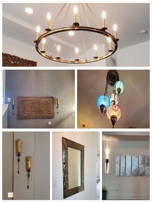 Chandelier, sconces, and mirror installed in a home