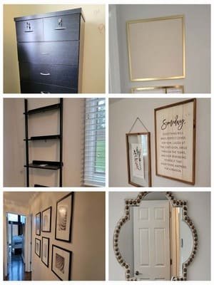 Framed prints, signs, and a mirror hung in a home
